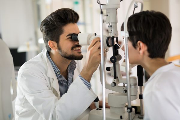 optometrist-checking-patient-eyesight-suggesting-vision-correction-treatments (1)